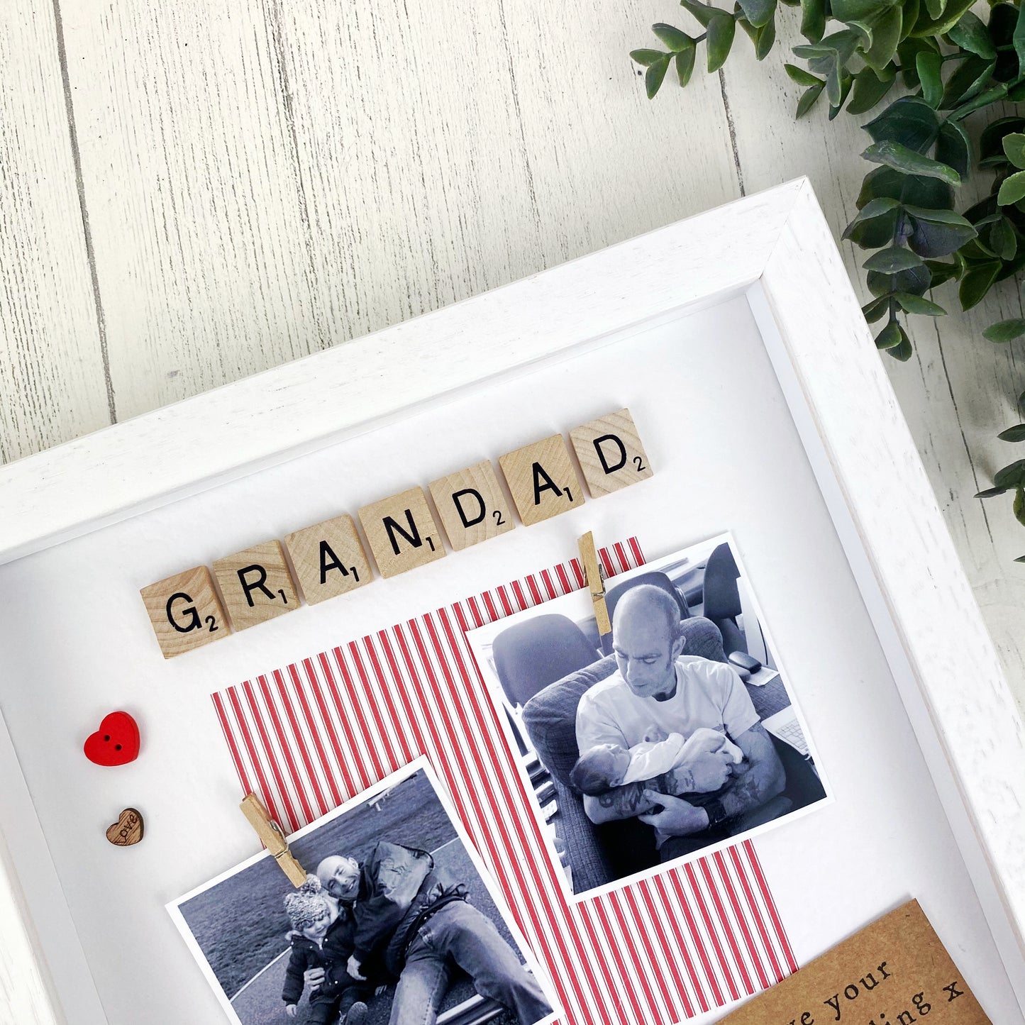 PPersonalised Liverpool Grandad photo frame gift for Father’s Day, featuring red striped design, message “You’ll never walk alone, Grandad,” scrabble-style GRANDAD tiles, and space for two uploaded photos. Handmade keepsake for Liverpool football fan grandads. Upload your pictures at checkout.