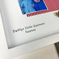 Personalised Arsenal Daddy photo frame gift for Father’s Day, featuring red and white colours, two photo slots, mini pegs, scrabble-style “DADDY” tiles, and message “Daddys little Gunners forever.” Handmade keepsake for football fan dads and Arsenal supporters. Perfect gift from baby or child for a proud Gooner.