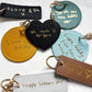 Collection of personalized keychains with handwritten messages on a white background
